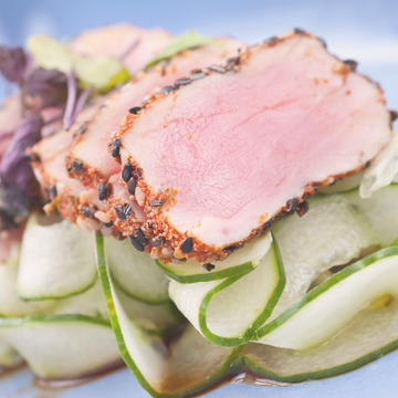 Image of sliced albacore tuna on cucumber slices