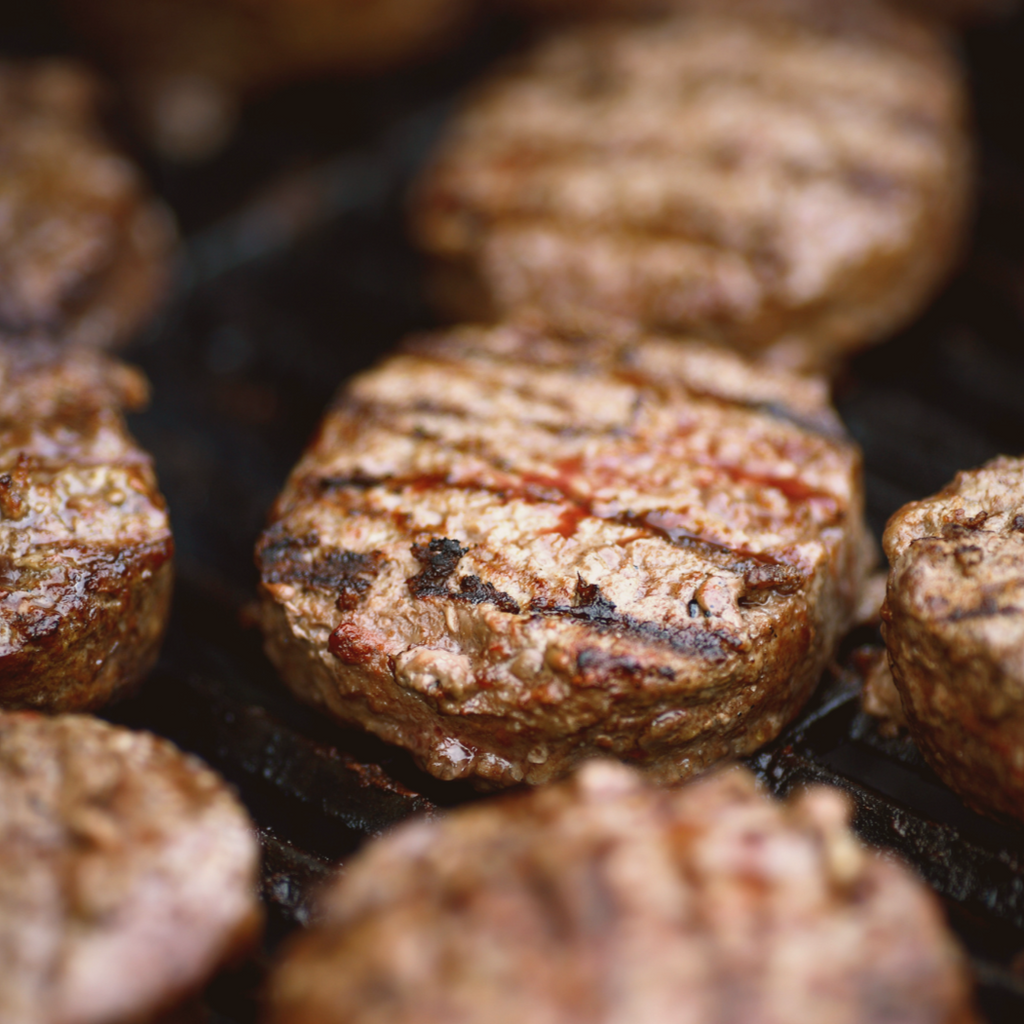 image of beef burger patties on a grill